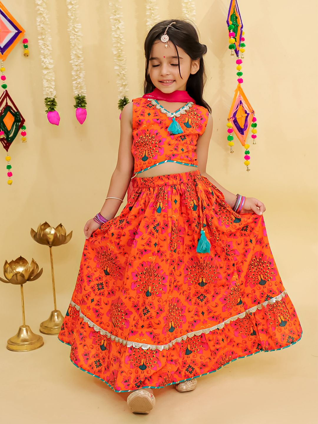Girl's traditional orange lehenga choli with dupatta