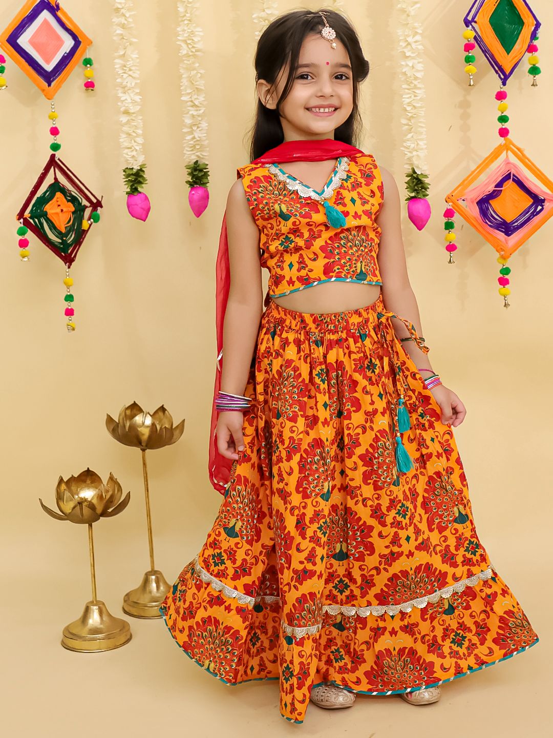 Girl's traditional yellow lehenga choli with dupatta