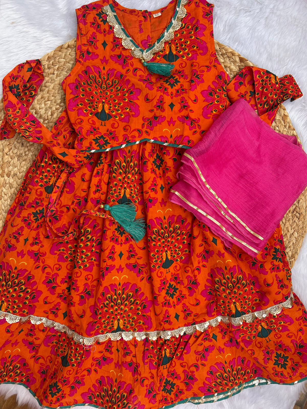 Girl's traditional orange lehenga choli with dupatta