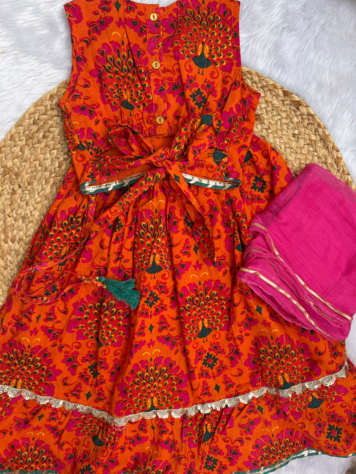 Girl's traditional orange lehenga choli with dupatta
